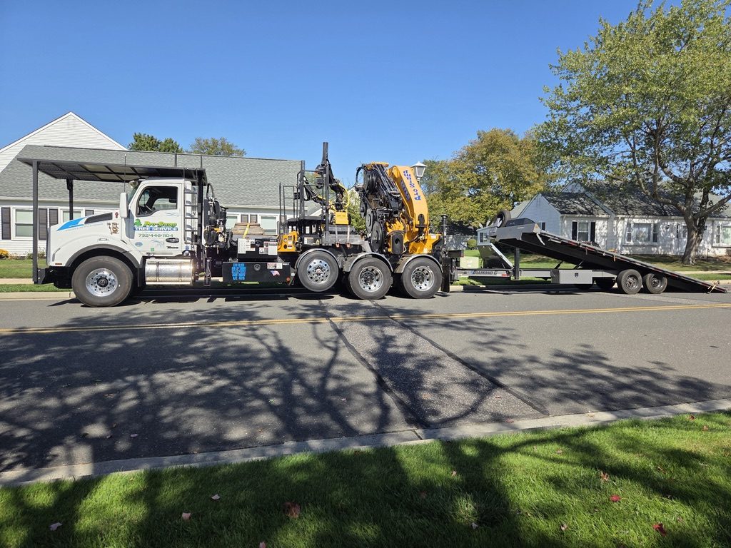 Pro-Stump Tree Service crane truck on a residential worksite