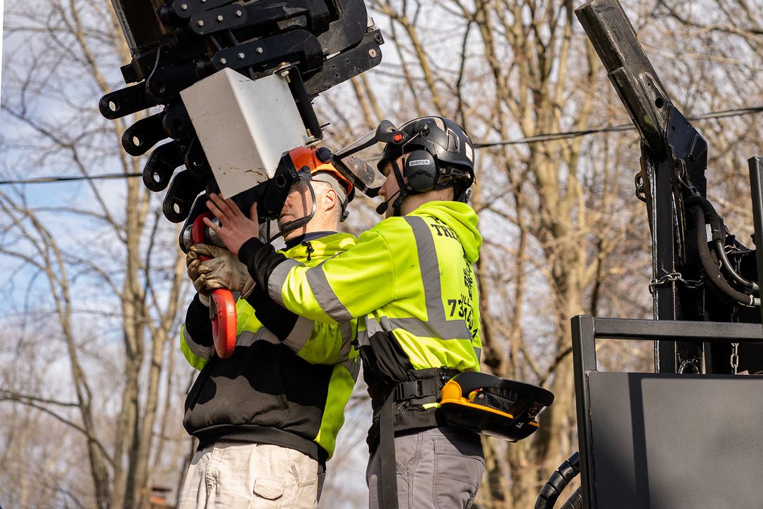 Pro-Stump crew operating a crane during tree removal