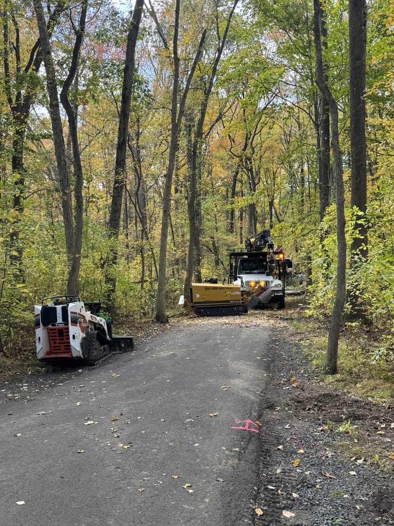 Bandit brush chipper during park land clearing by Pro-Stump Tree Service